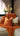 Paul Moneypenny Necking Orange Cushion