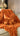 Paul Moneypenny Tied Up Orange Cushion