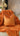 Paul Moneypenny Two Face Orange and Chocolate Cushion