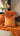 Paul Moneypenny Two Face Orange and Chocolate Cushion